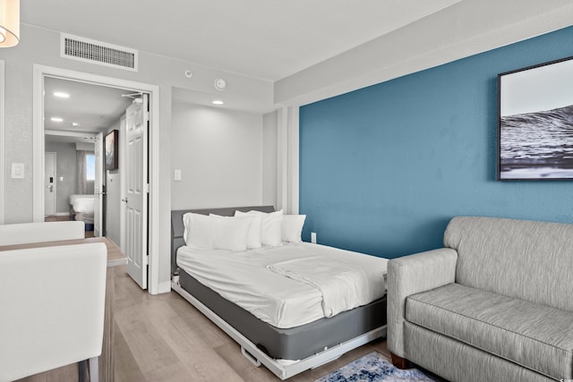 bedroom featuring light hardwood / wood-style flooring