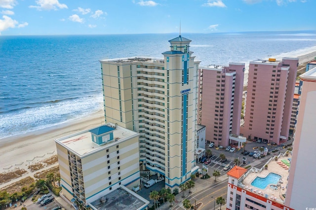 bird's eye view featuring a water view and a view of the beach