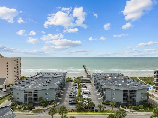 drone / aerial view with a beach view and a water view