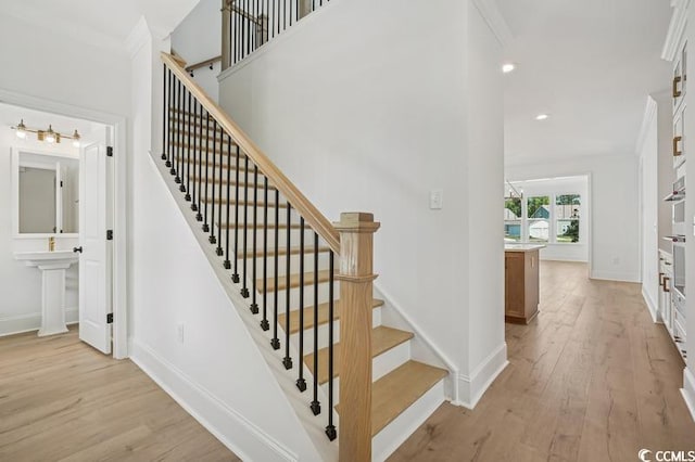 1816 Tryon Dr, Myrtle Beach, SC 29588 - staircase with wood finished floors, baseboards, recessed lighting, and ornamental molding