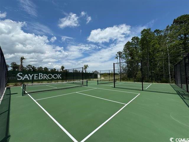 view of sport court featuring community basketball court and fence