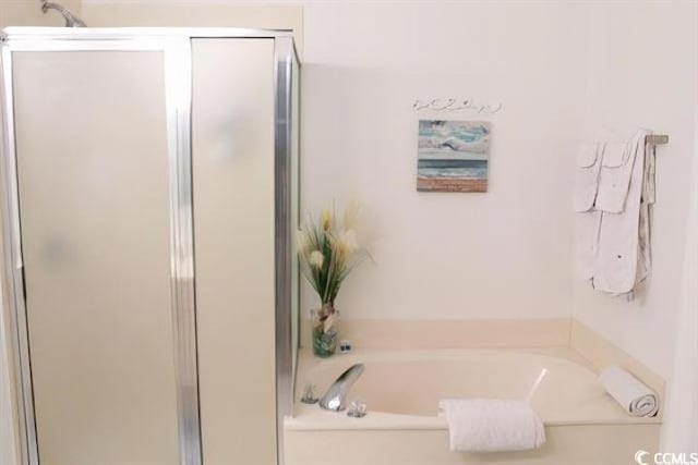 bathroom with separate shower and tub