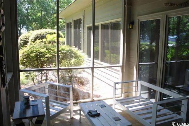 sunroom / solarium featuring plenty of natural light