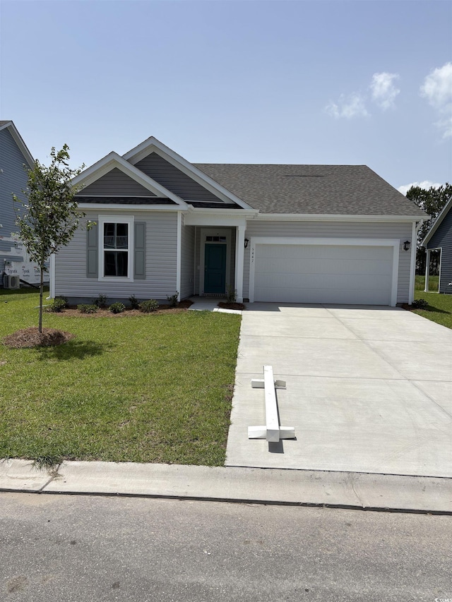 5447 Shelly Lynn Dr, Myrtle Beach, SC 29579 - single story home with concrete driveway, a garage, a front lawn, and roof with shingles