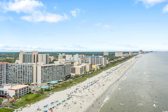 bird's eye view featuring a view of the beach and a water view