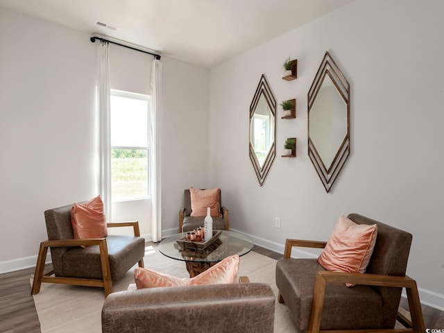 living area with light hardwood / wood-style flooring