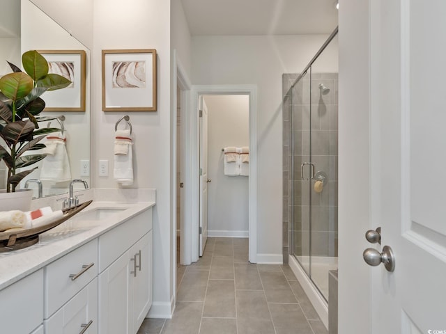 bathroom with vanity, tile patterned flooring, and a shower with shower door