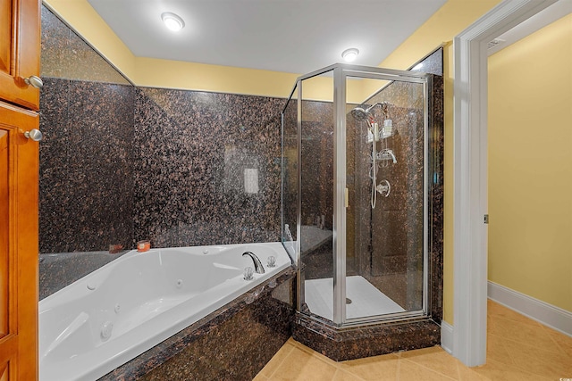 bathroom with tile patterned floors and separate shower and tub