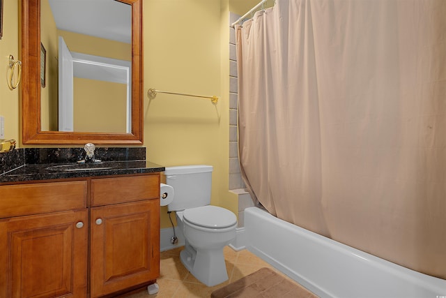 full bathroom with vanity, shower / tub combo, tile patterned floors, and toilet