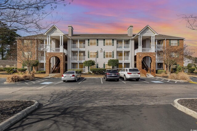 view of outdoor building at dusk