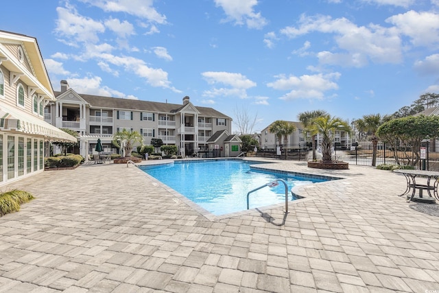 view of swimming pool with a patio area