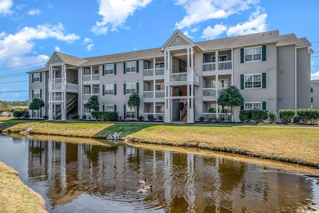 view of building exterior with a water view