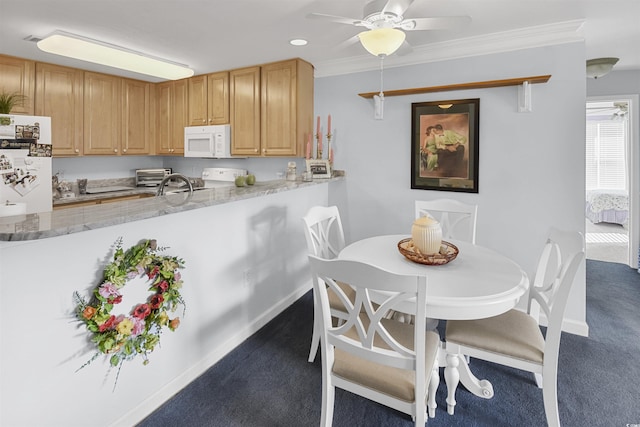 kitchen with crown molding, white appliances, kitchen peninsula, and dark colored carpet