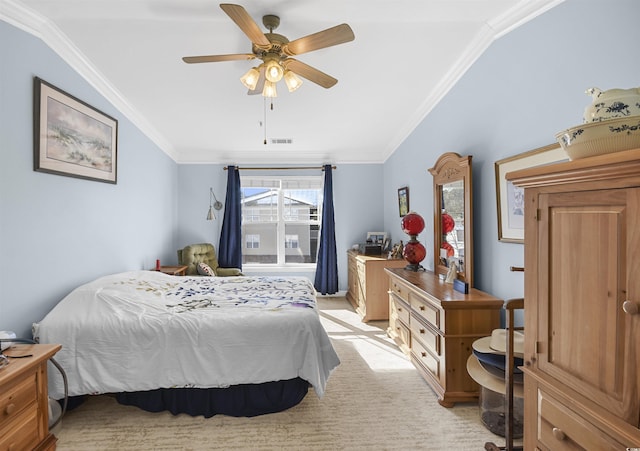 bedroom featuring light colored carpet, ornamental molding, and ceiling fan