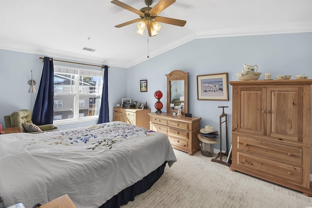 carpeted bedroom featuring ceiling fan, ornamental molding, and lofted ceiling