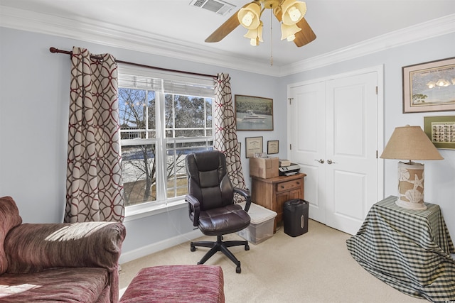 carpeted home office with crown molding, plenty of natural light, and ceiling fan