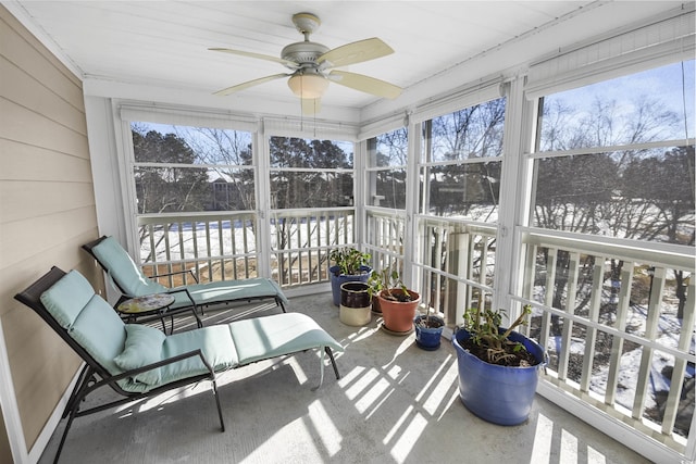 sunroom featuring ceiling fan