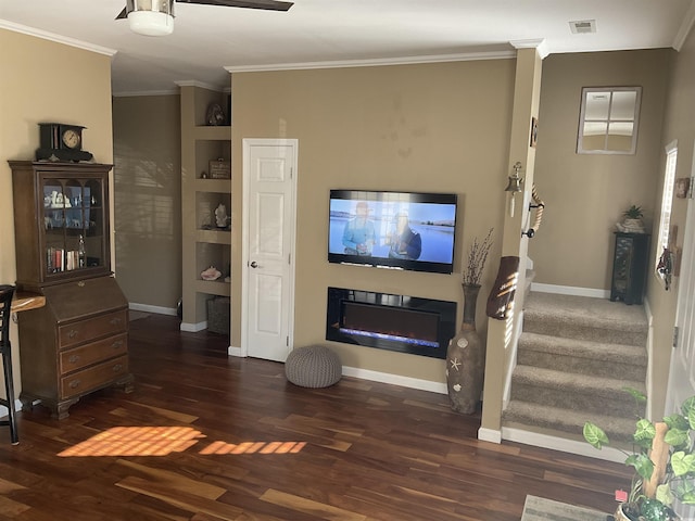 living room with crown molding and dark hardwood / wood-style floors