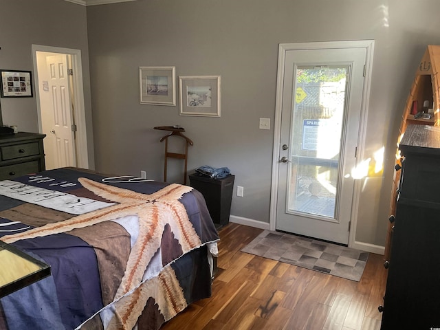 bedroom featuring ornamental molding and hardwood / wood-style floors