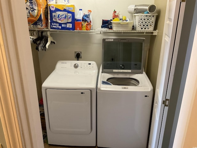 laundry room featuring separate washer and dryer