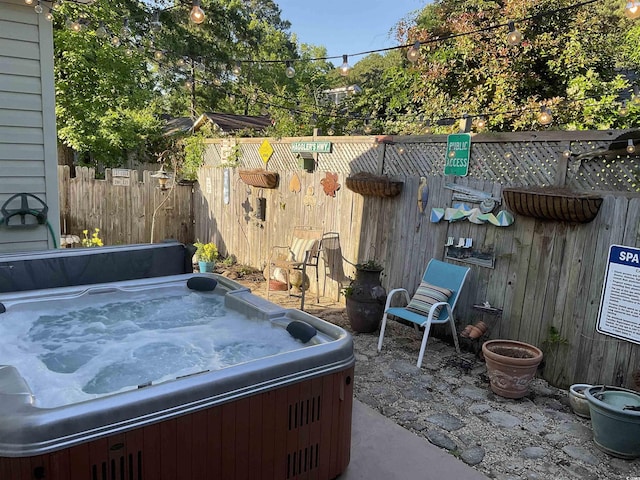 view of patio / terrace featuring a hot tub