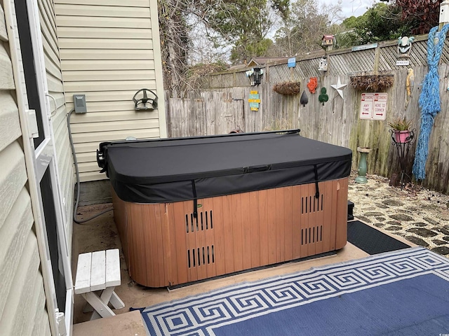 view of patio with a hot tub