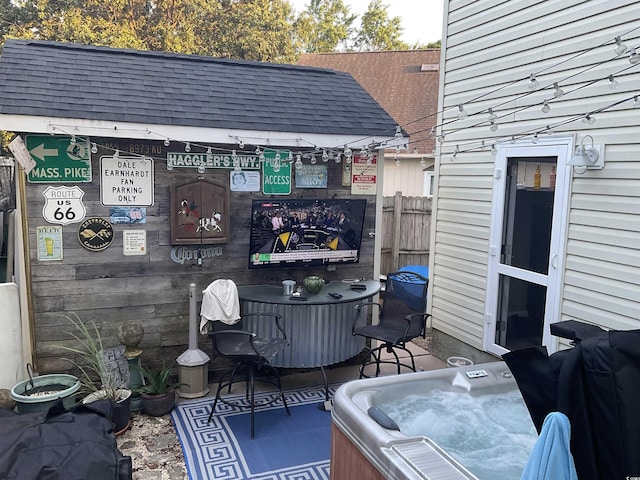 view of patio / terrace featuring a hot tub