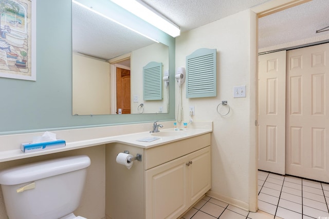 9550 Shore Dr Unit 722, Myrtle Beach, SC 29572 - bathroom featuring vanity, tile patterned floors, toilet, and a textured ceiling
