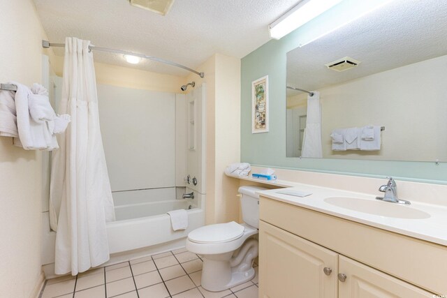 9550 Shore Dr Unit 722, Myrtle Beach, SC 29572 - full bathroom with tile patterned floors, toilet, a textured ceiling, vanity, and shower / bathtub combination with curtain