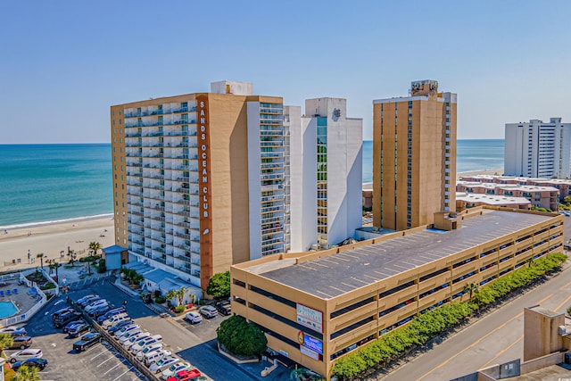 bird's eye view with a water view and a view of the beach