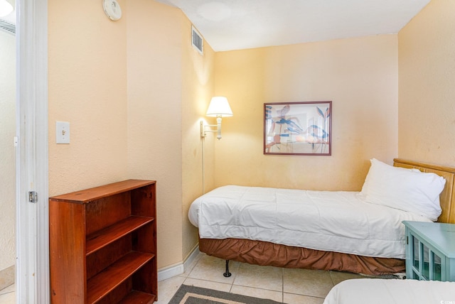 bedroom featuring light tile patterned floors