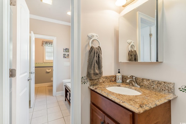 bathroom with crown molding, vanity, toilet, and tile patterned flooring