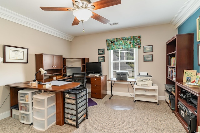 carpeted home office featuring ceiling fan and ornamental molding