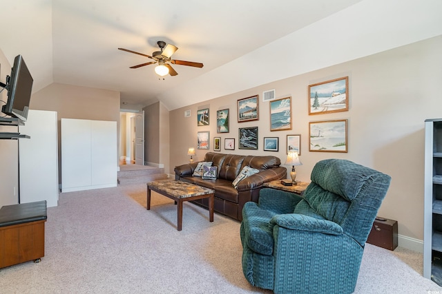 living room with lofted ceiling, light carpet, and ceiling fan