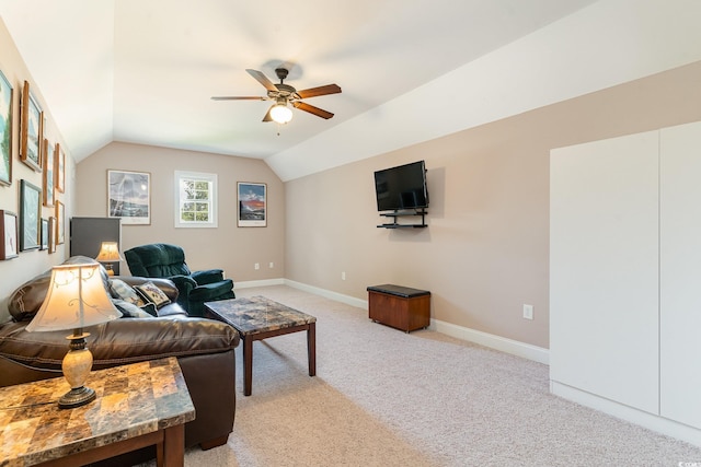 living room featuring ceiling fan, light colored carpet, and lofted ceiling