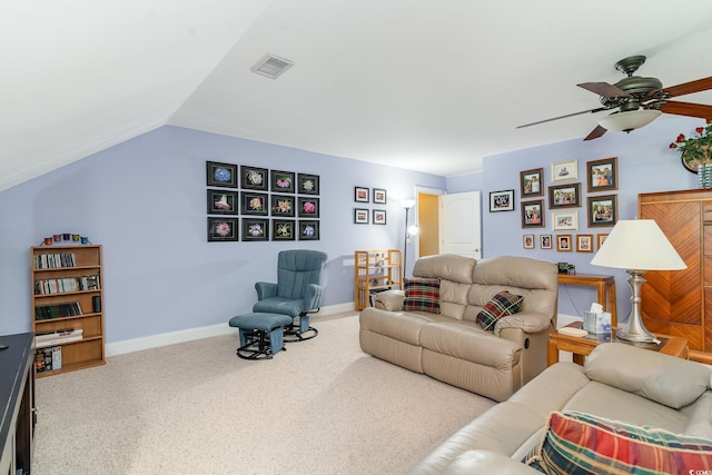 living room featuring lofted ceiling, ceiling fan, and carpet flooring