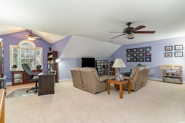 home office featuring light carpet, lofted ceiling, and ceiling fan