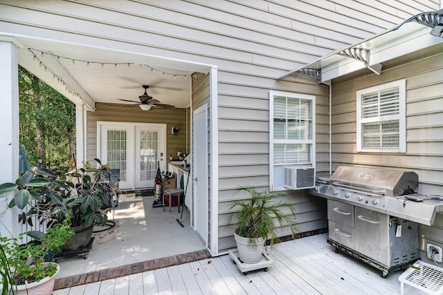 deck with area for grilling, cooling unit, and ceiling fan