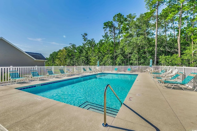 view of swimming pool featuring a patio