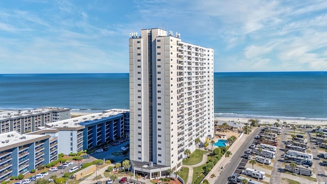 bird's eye view featuring a beach view and a water view