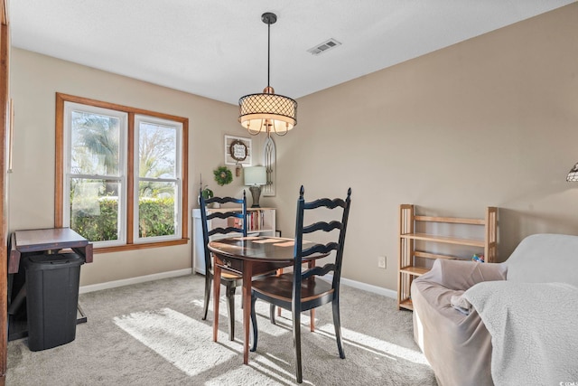 dining area with light colored carpet