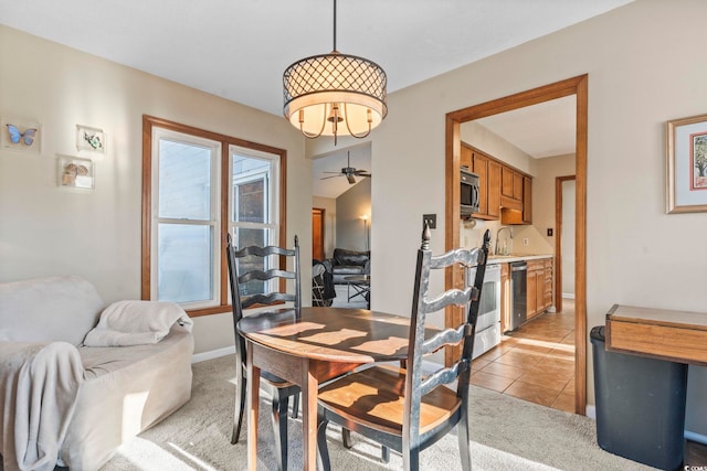 dining room featuring light tile patterned flooring and sink