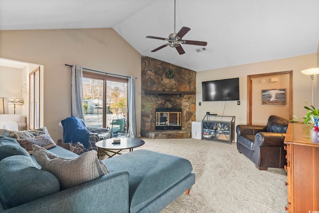 carpeted living room featuring lofted ceiling, a stone fireplace, and ceiling fan