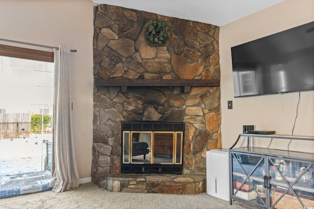 carpeted living room featuring a fireplace