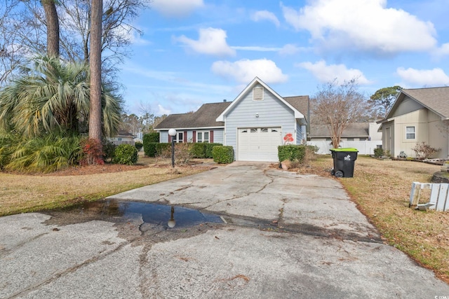 view of property exterior featuring a garage and a lawn