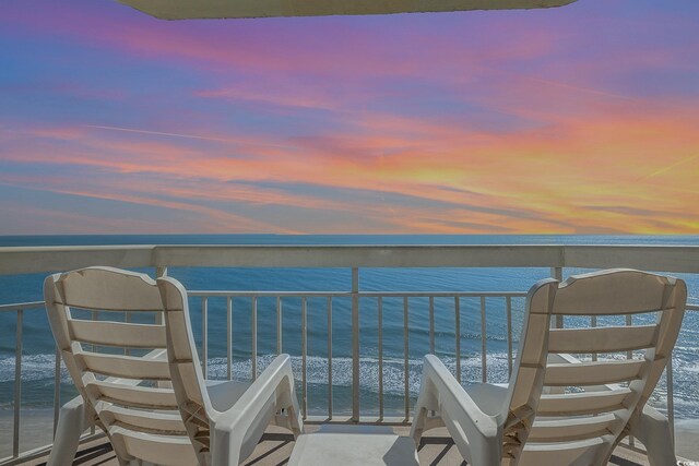 balcony at dusk with a water view