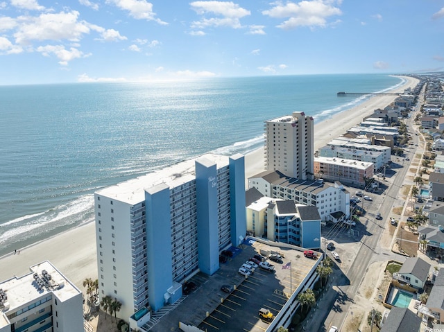 aerial view featuring a view of the beach and a water view