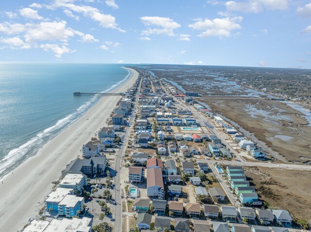 aerial view featuring a water view and a beach view