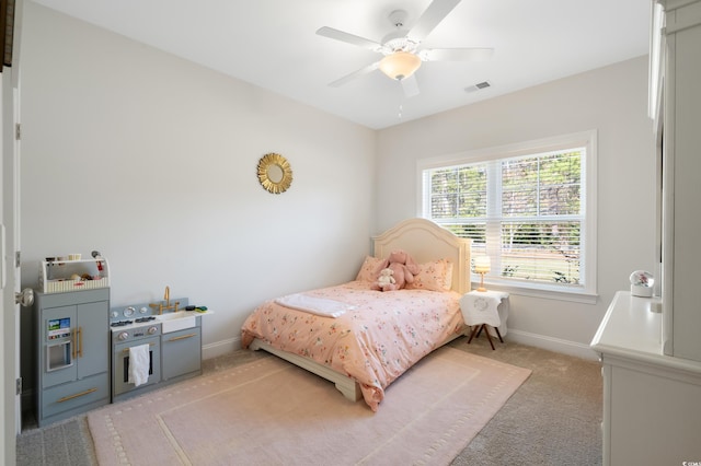 bedroom with light colored carpet and ceiling fan