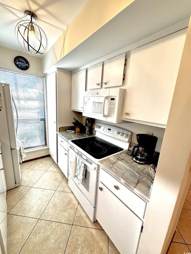 kitchen featuring white cabinetry, white appliances, and light tile patterned flooring